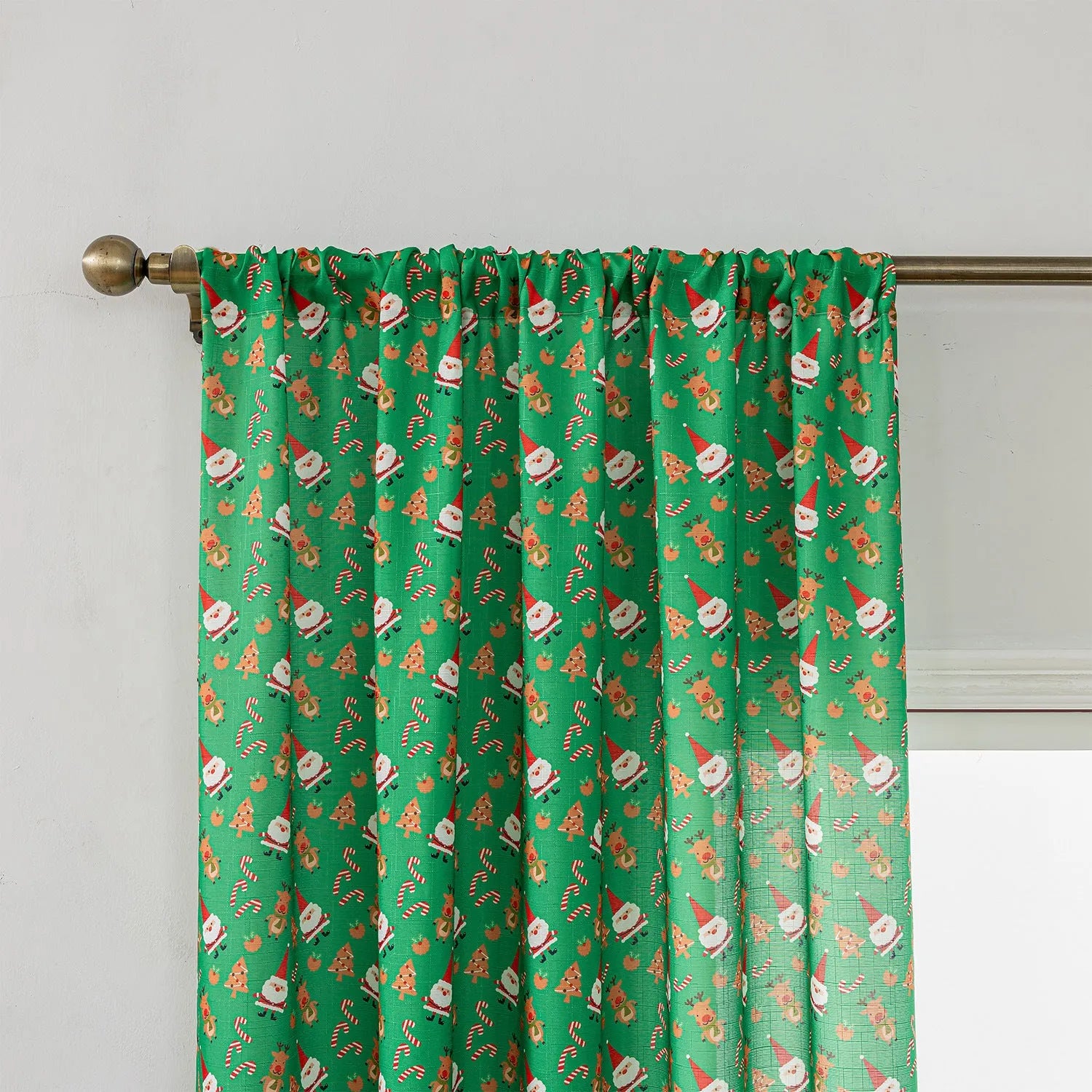 Green Christmas curtain with printed cartoon snowmen and angels, American style.