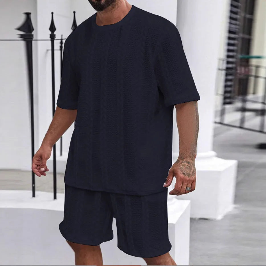 Knitted jacquard short sleeve pullover and matching shorts set in a solid colour on a hanger.