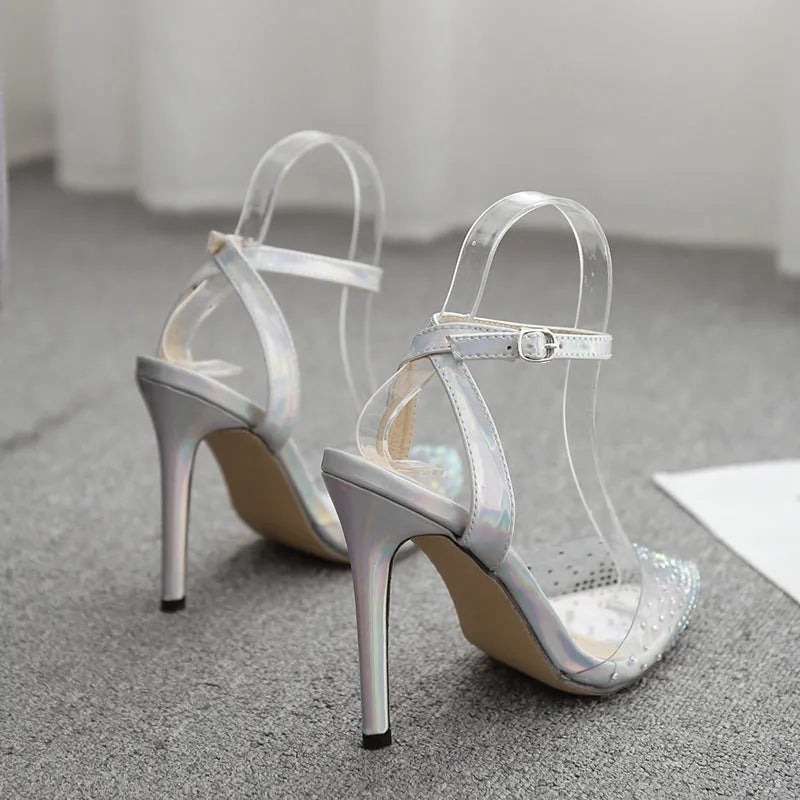 Gold glitter pointed toe stiletto sandals for women on a white background