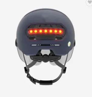 Cycling helmet with built-in LED brake and tail lights on the back, shown in sizes M and L.