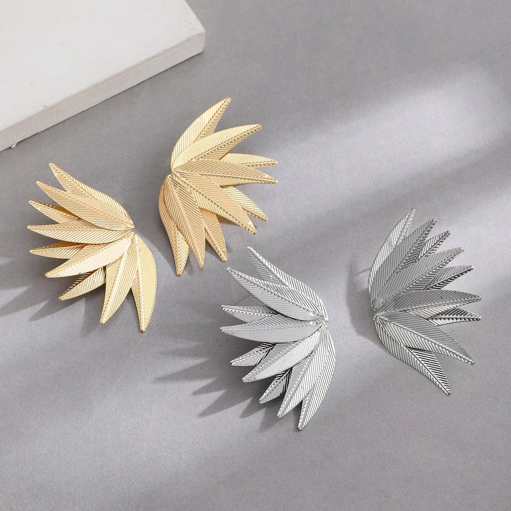 Gold and white leaves patch alloy earrings with leaf design texture