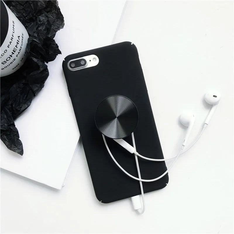 Ring phone stand in silicone and metal acting as a grip and stand for a mobile phone