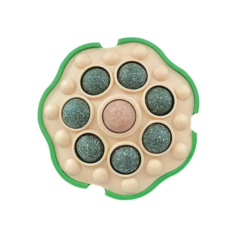 Green adhesive catnip ball toy for walls measuring 10.5x10.5cm with edible filling