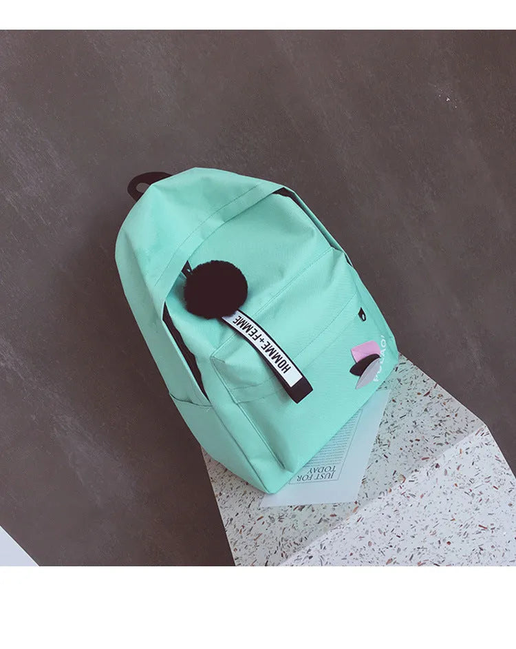 Canvas college style schoolbag backpack in green with leaf pattern, showing 40x28x13cm dimensions