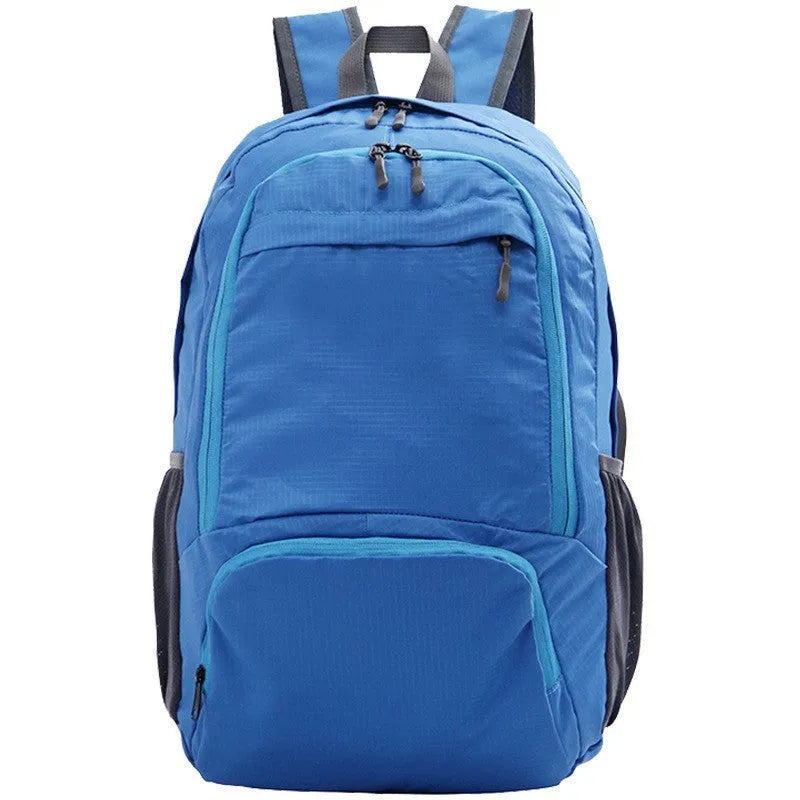 26 inch solid colour foldable backpack in Oxford cloth shown in black, blue, brick red, grey, green, orange, and purple.