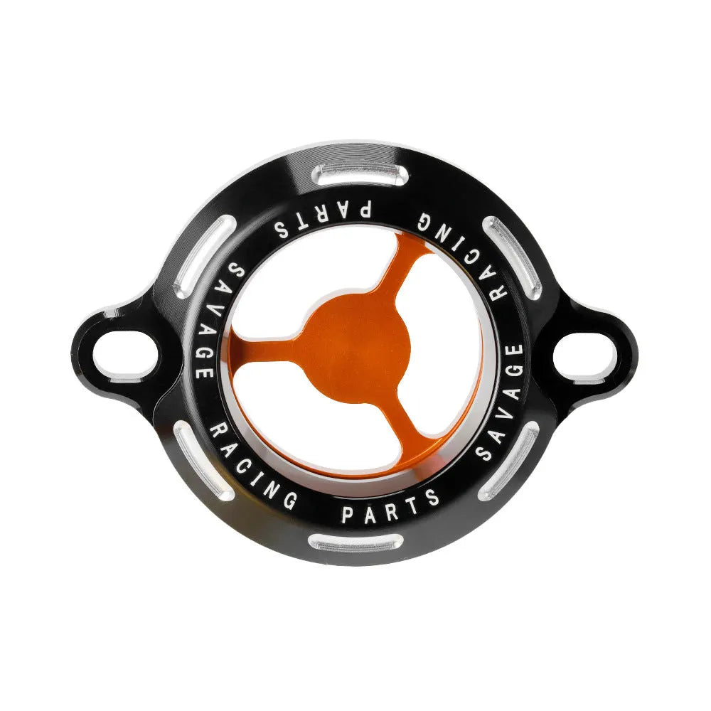 Aluminium alloy transparent oil filter cover for KTM DUKE motorcycles on a workbench