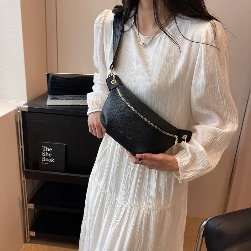 PU waist bag in black with spliced design and single shoulder strap for daily wear