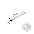 Stainless steel wall-mounted magnetic knife storage rack in various lengths on a kitchen wall.