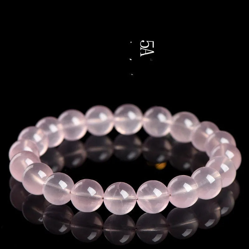 Crystal bracelet with polished pink round beads in natural starlight design showing single circle construction