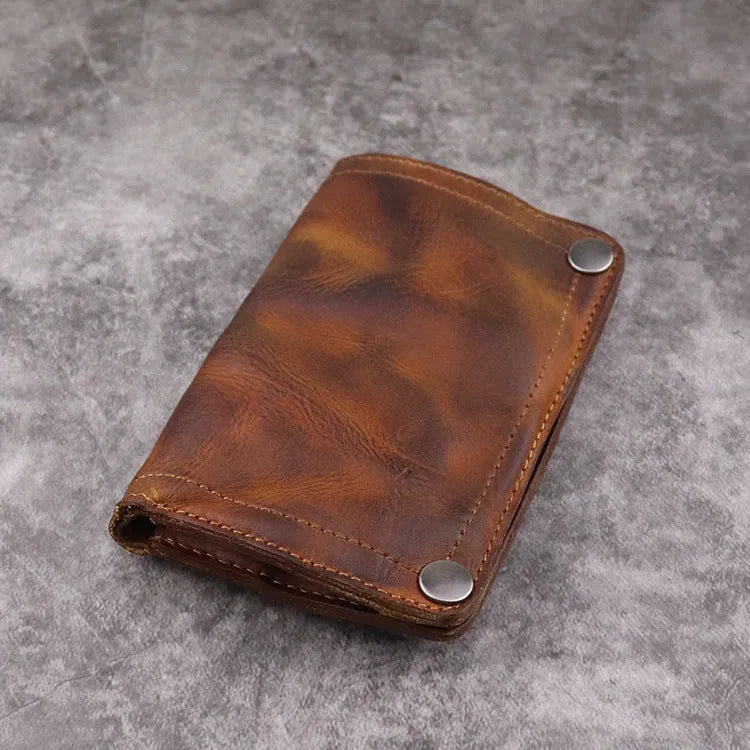 Men's retro style vertical long wallet in genuine cowhide leather showing multiple internal card slots and compartments.