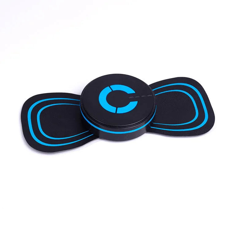 Black HQ-185 mini electric shoulder and neck massager with massage patch, shown next to a ruler for scale.