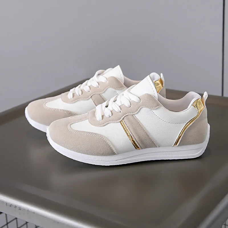 Women's casual flat sports shoes in grey with fabric canvas upper and PVC sole, low-top design