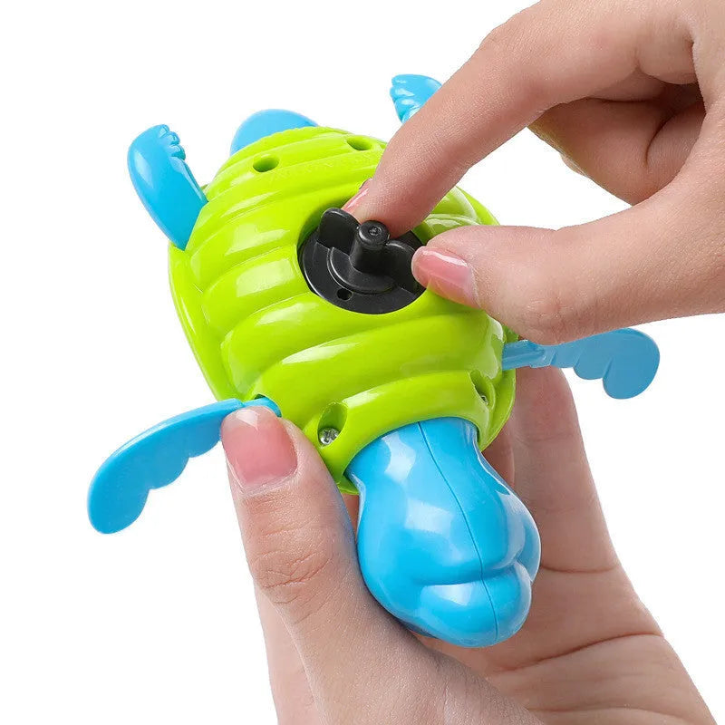 Plastic swimming turtle baby bath toy floating in water for aquatic play