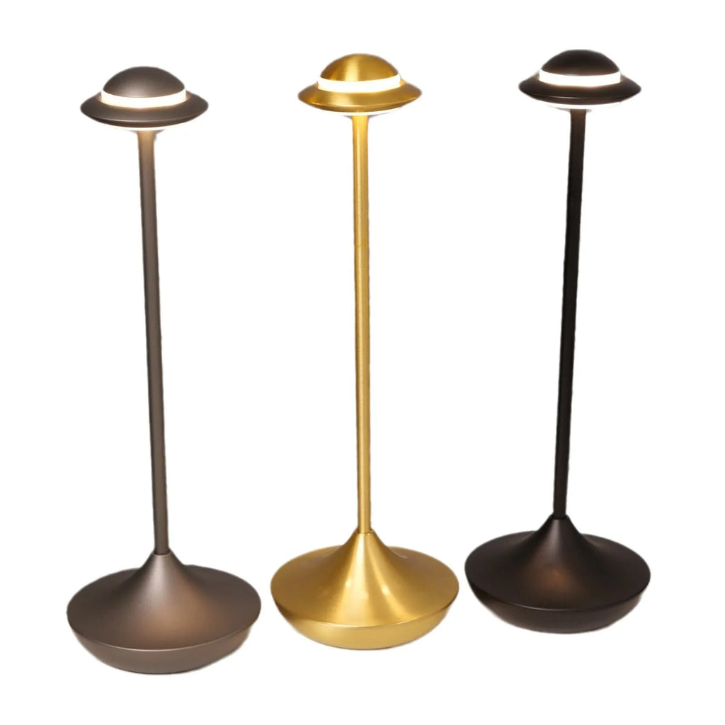 Metallic gold UFO-shaped rechargeable table lamp with touch-sensitive dimming controls.