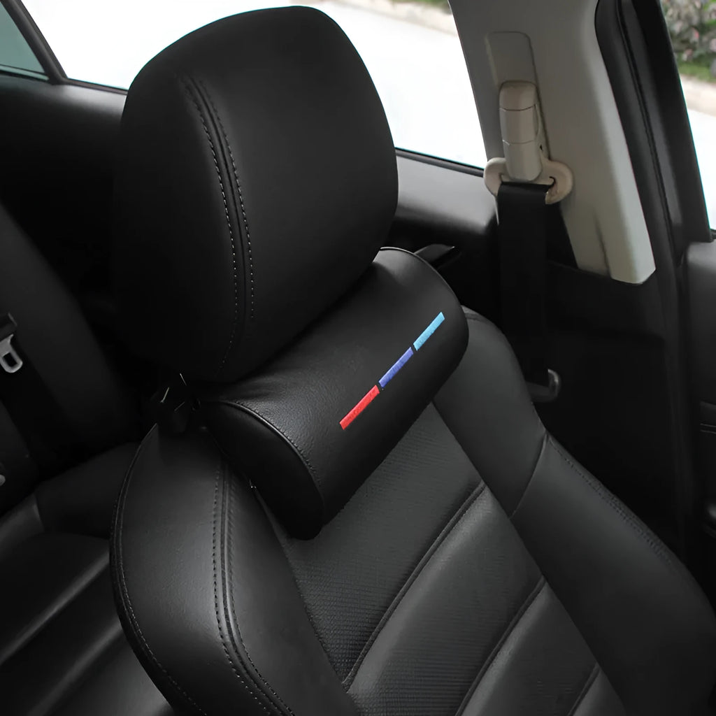 Black cotton car seat neck pillow for travel support on a car headrest