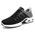 Men's black and gray Flyknit mesh casual sneakers with flat sole and lace-up front