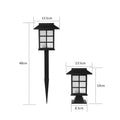 Black solar-powered LED lawn light for outdoor garden and pathway illumination.