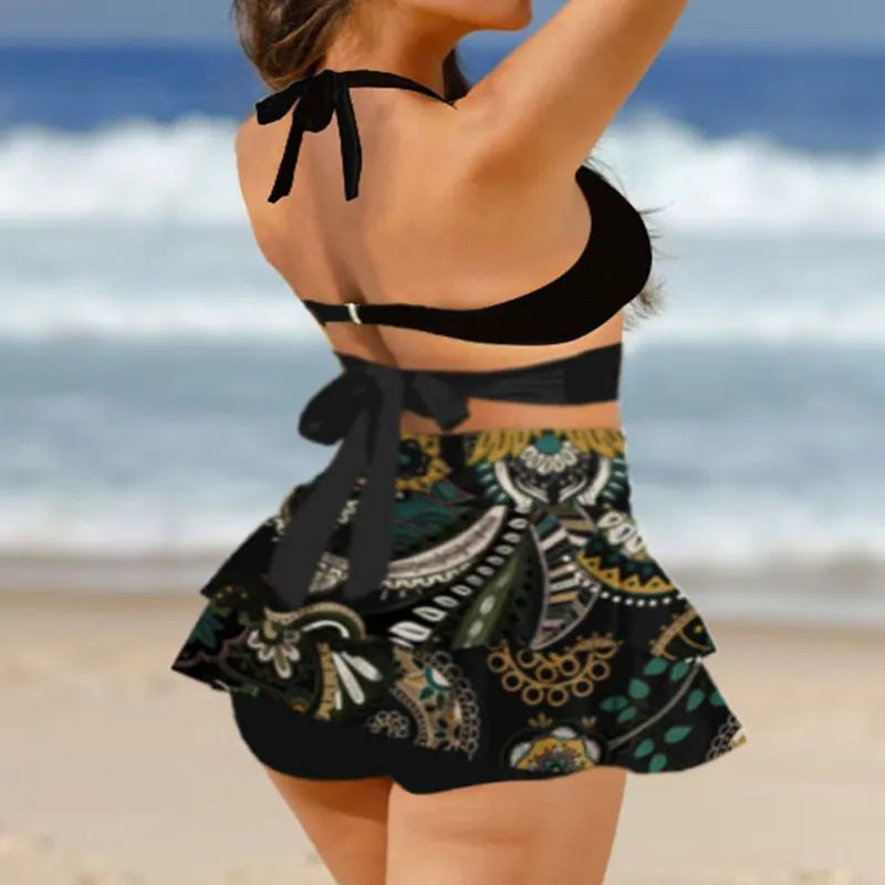 Purple and black women's bikini swimsuit set with lace-up details and a matching skirt.