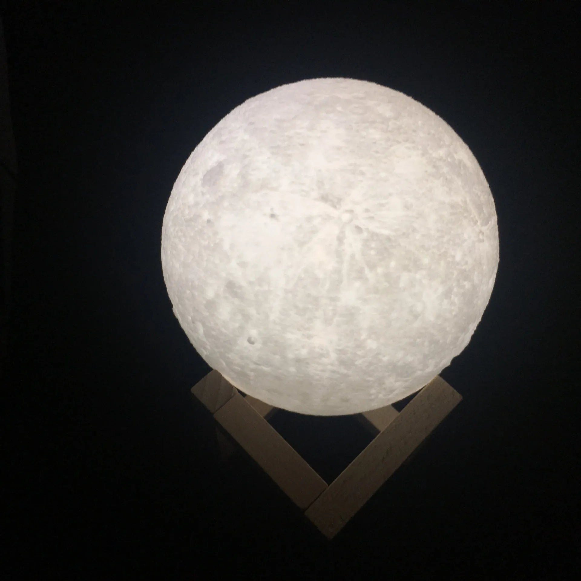 3D printed moon lamp on wooden stand showing lunar surface details with touch control ring