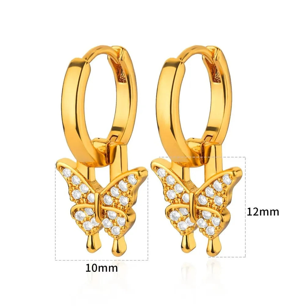 Women's geometric butterfly earrings in copper with heart and star details