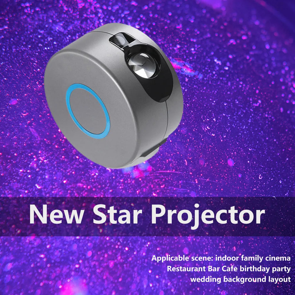 Grey starry sky projection lamp with remote control on a table, projecting colourful light dots on a dark wall.
