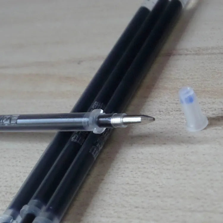Automatic fade and disappear pen set showing pen holder, case, and eight refill cartridges of vanishing ink