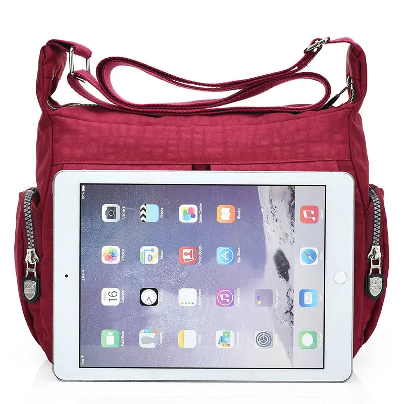 Nylon shoulder crossbody bag in casual style, available in multiple colours like black and red.