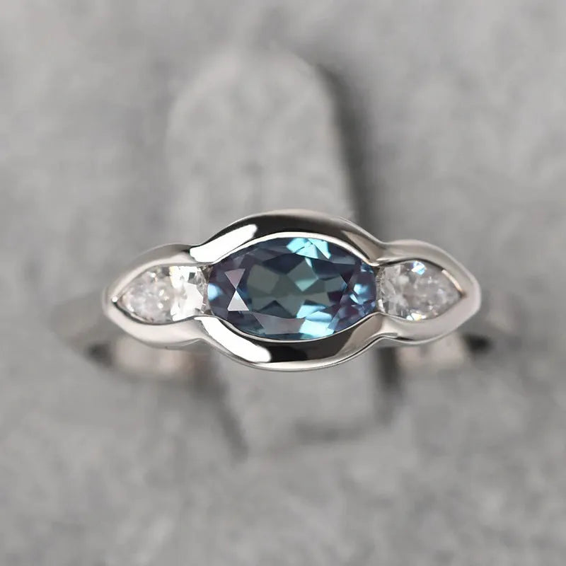 Geometric ellipse zircon ring in white gold colour on copper base