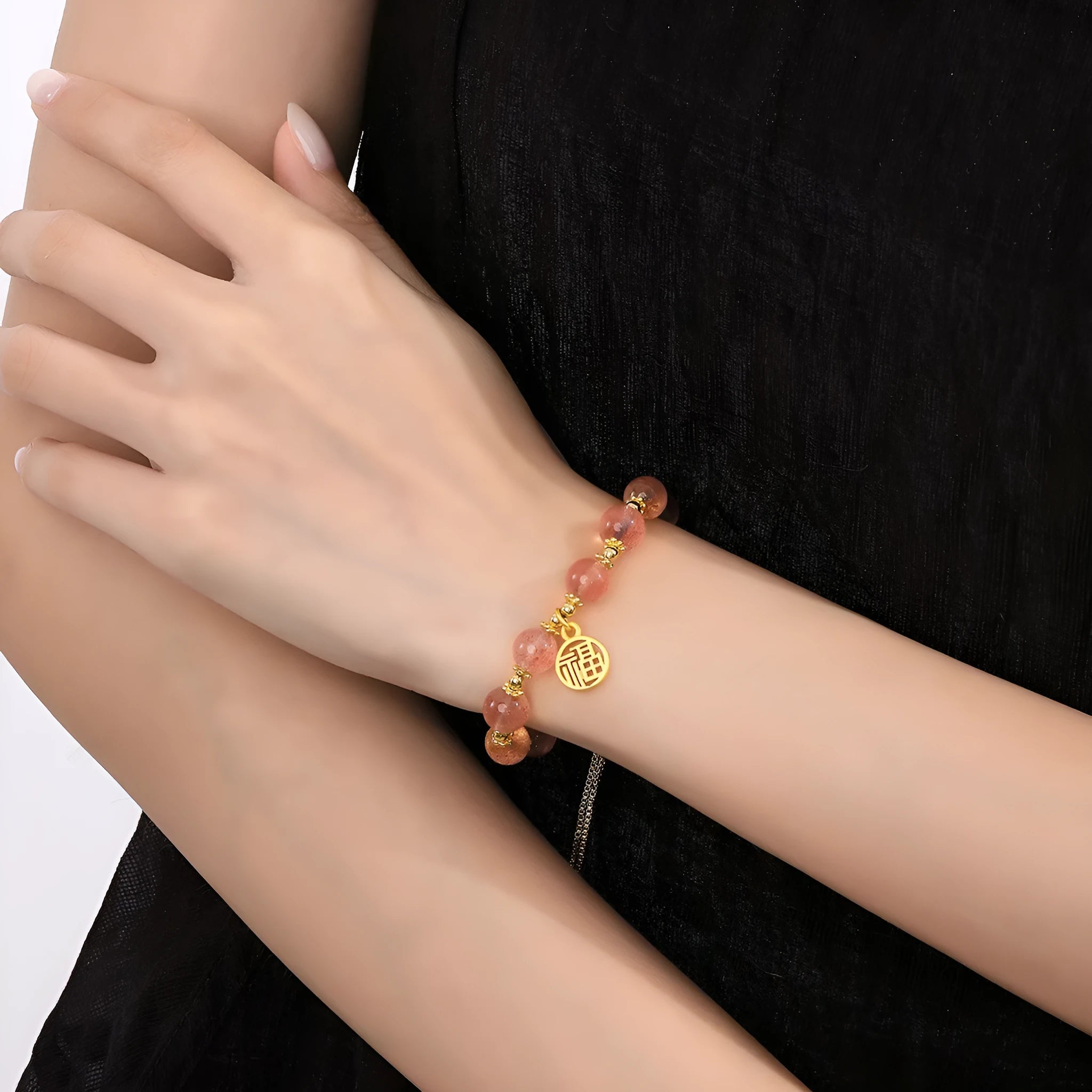 Women's strawberry quartz crystal bracelet with electroplated fu character charm and geometric design