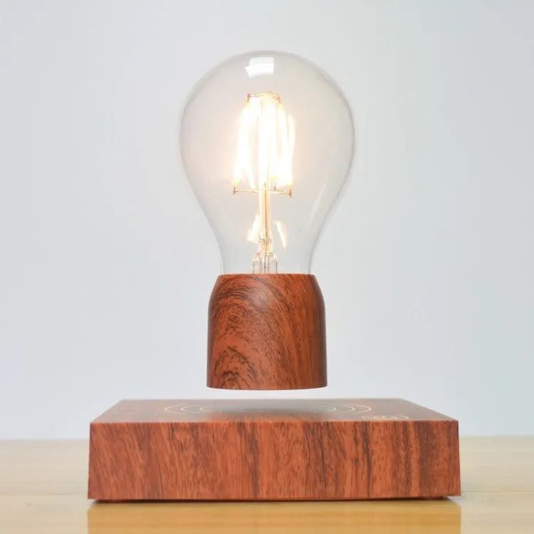 Magnetic levitation desk lamp with floating light bulb on imitation wood base.