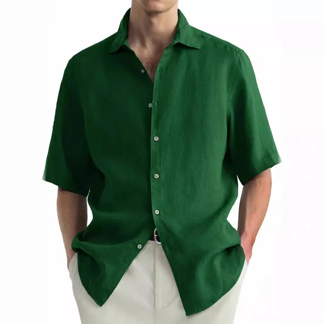 Man wearing a green washed cotton casual cardigan-style shirt.