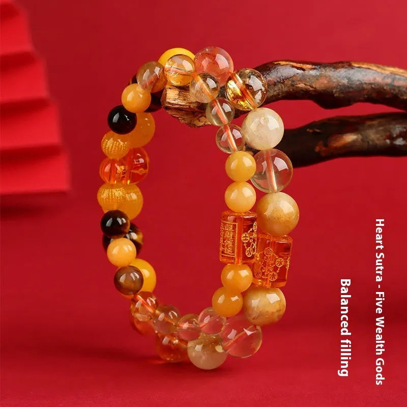 Handmade Five Elements crystal bracelet showing gold wood water fire soil colours