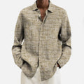 Man wearing a multi-colour patterned, long-sleeve cardigan-style shirt for casual leisure.