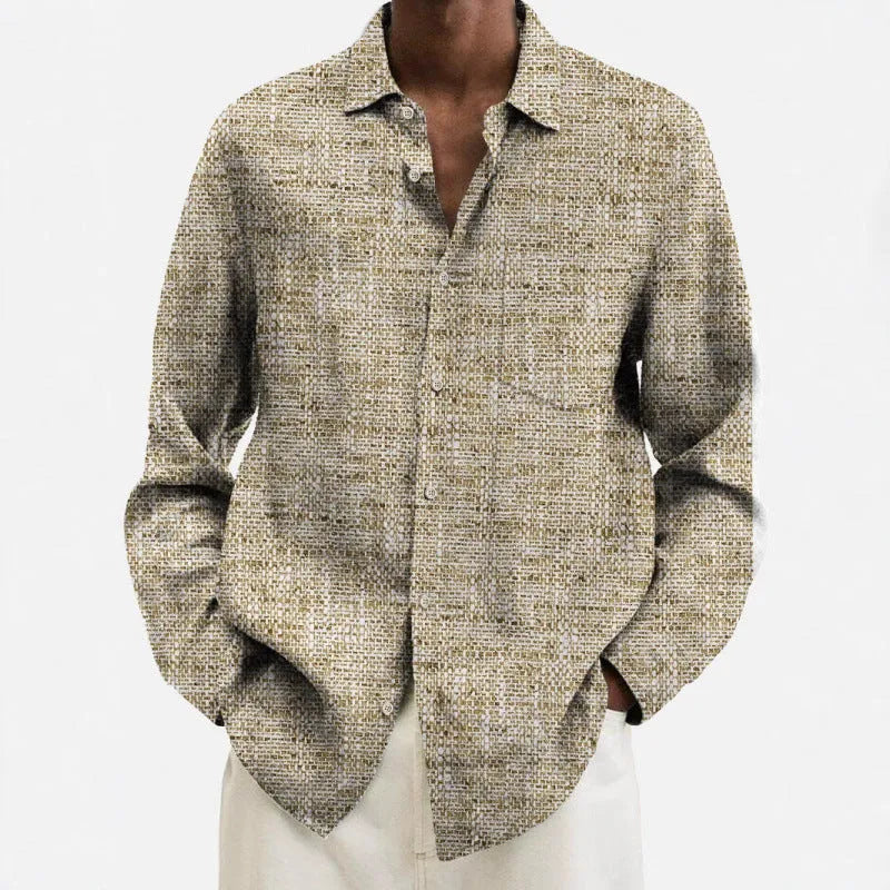 Man wearing a multi-colour patterned, long-sleeve cardigan-style shirt for casual leisure.