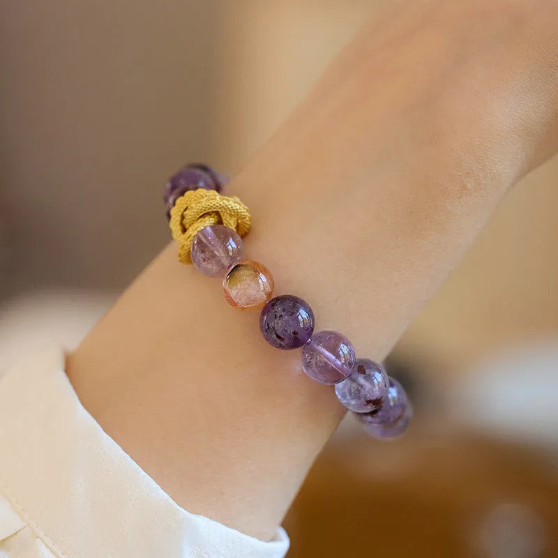Purple crystal bracelet with 10mm beads featuring Nine Purple Good Luck design and animal zodiac motifs