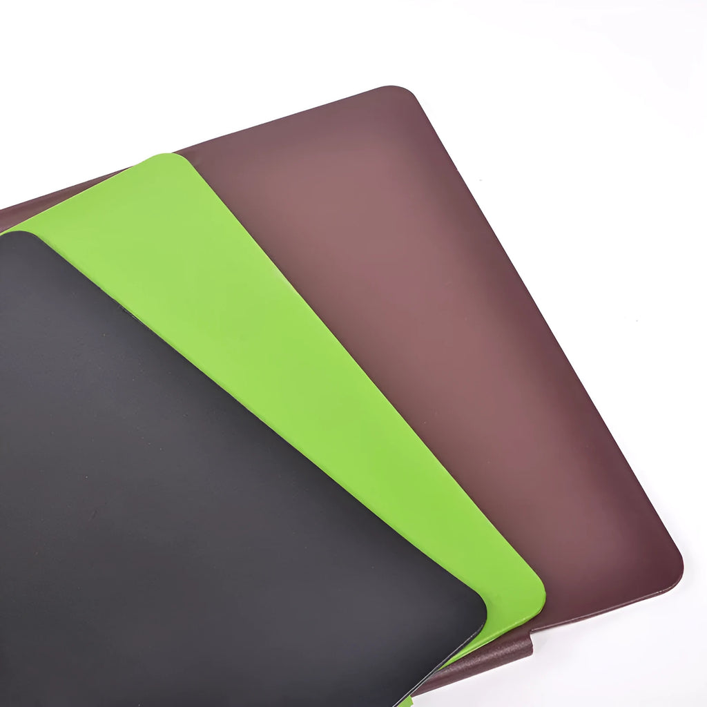 Large PVC computer desk mat 700x450mm in black with non-slip backing on a desk