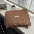 Four-layer gauze cotton blanket with tassel trim in an array of ten colours