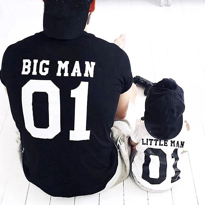 Parent and child wearing matching solid colour cotton T-shirts in black and white