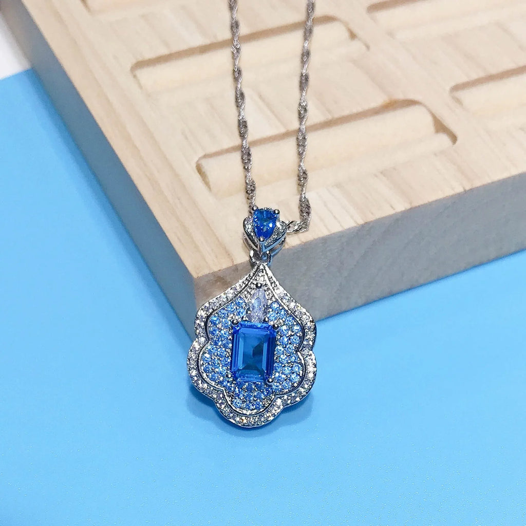 Sea blue copper geometry sky mirror pendant on plain background