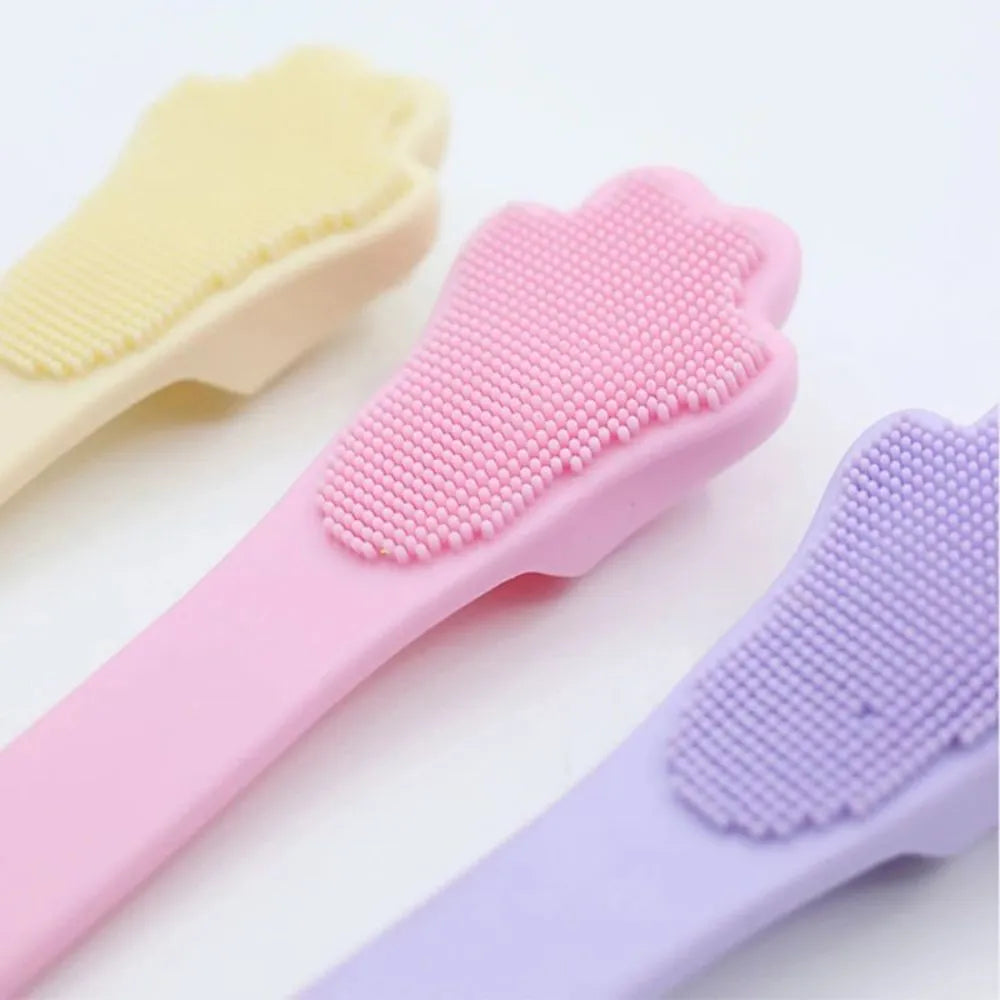 Silicone finger toothbrush for pets in pink, purple and yellow colours