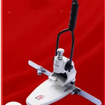 T30 single hole manual punching machine on a desk with paper stack inserted, adjustable edge guide visible