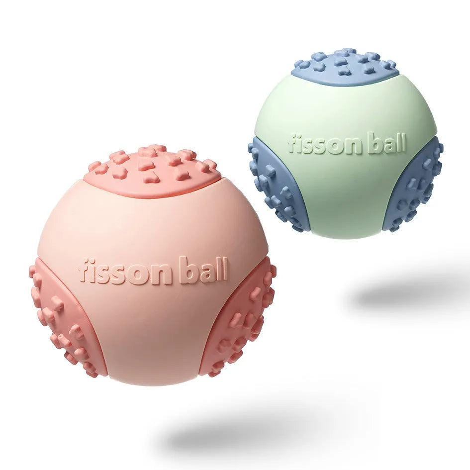 Green and pink motion-activated rolling ball dog toy for small to medium dogs