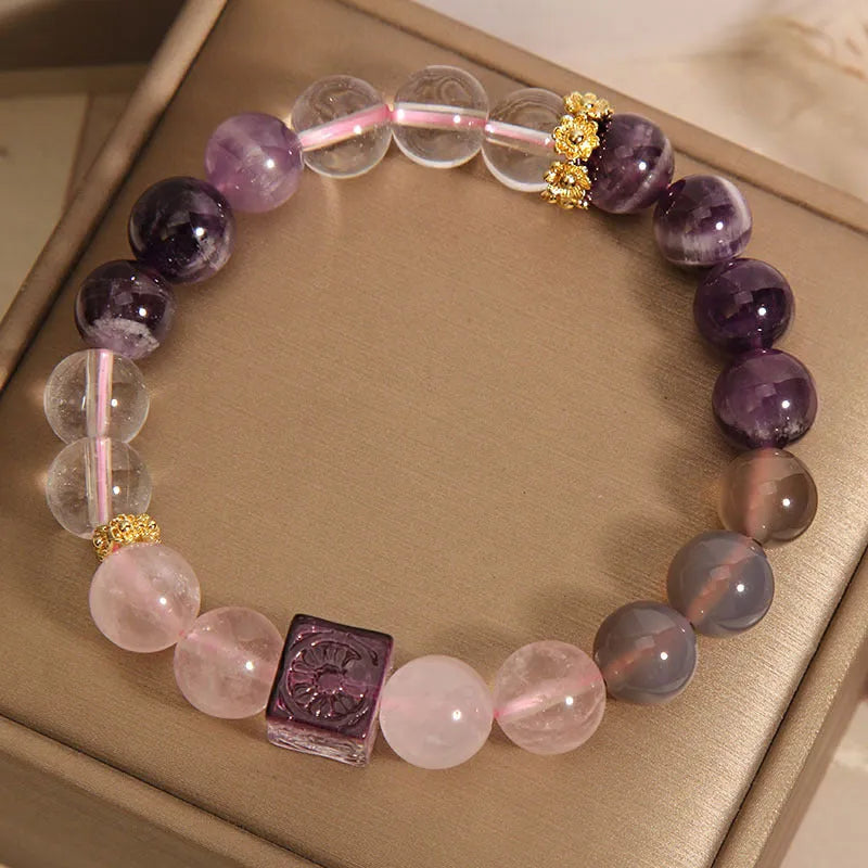 Purple natural amethyst crystal bracelet with rhinestone elements on adjustable band