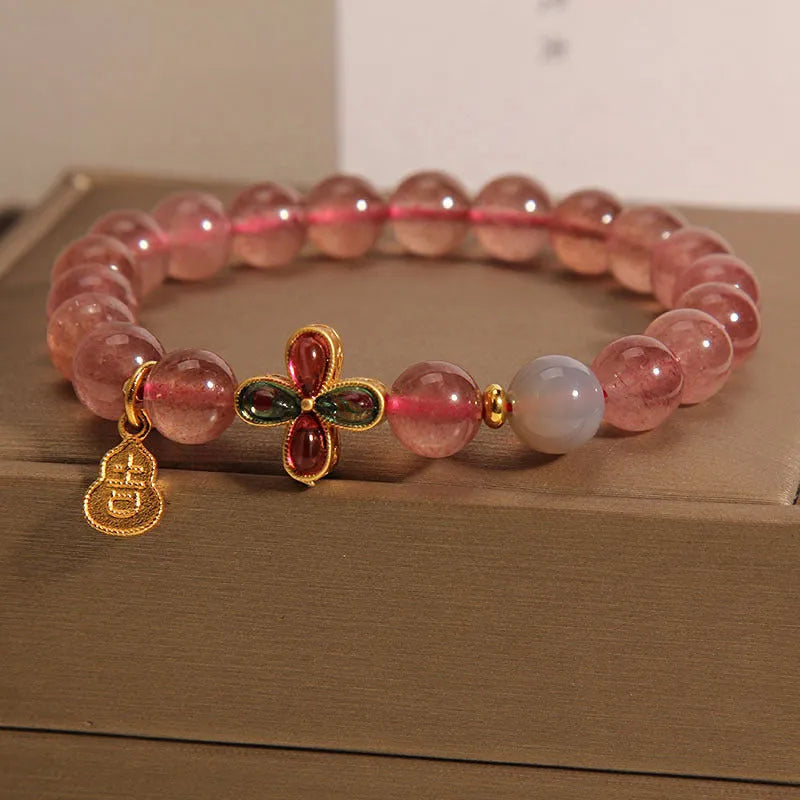 Natural strawberry quartz bracelet for women with four-leaf clover and calabash pendant on alloy chain with rhinestone accents