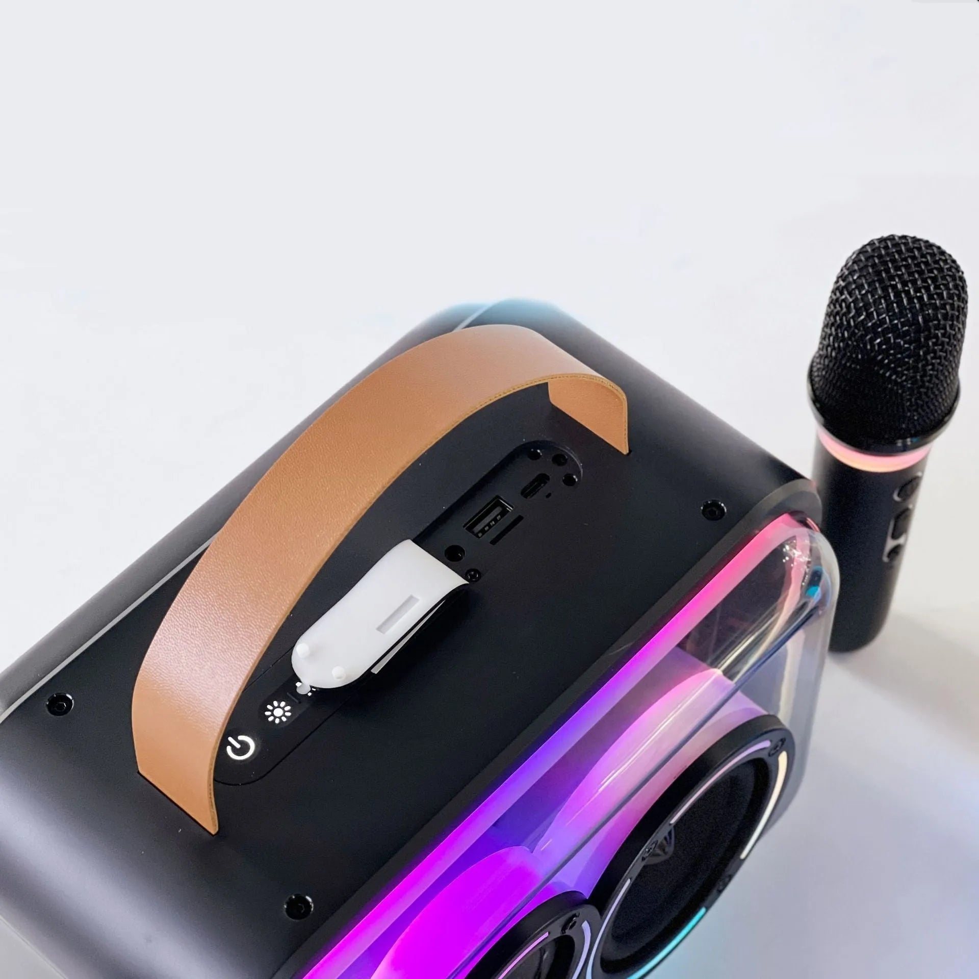 Portable Bluetooth karaoke speaker with RGB lights in light yellow or black with microphone