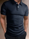 Man wearing a loose fit striped polo shirt in a light blue colour with an asymmetric design detail.