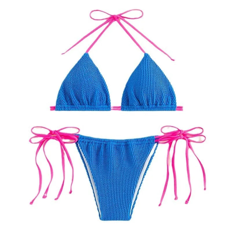 Women's black lace-up bikini swimsuit set laid flat.