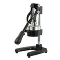 Black and white manual cast iron citrus juicer with stainless steel funnel, 40cm tall.