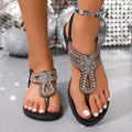 Women's blue bohemian sandals with rhinestone decoration on straps and a rubber sole.