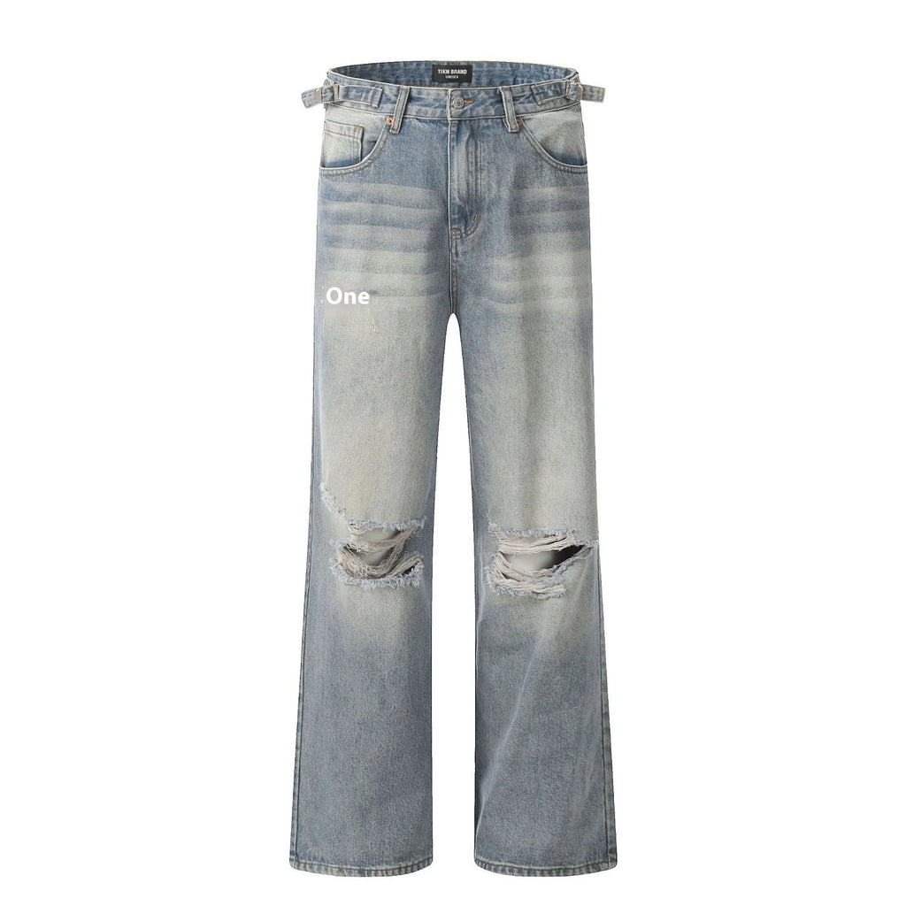 Blue men's straight-leg ripped jeans on a neutral background, showing zipper fly and cotton blend fabric texture.